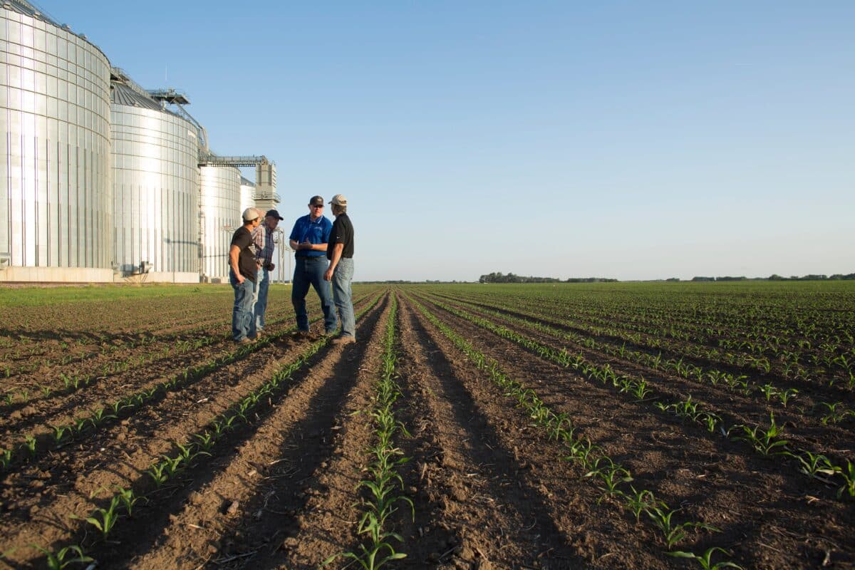 team meeting in crop field